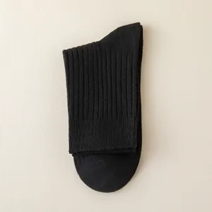 Classic black ribbed men's socks, comfortable cotton casual wear for autumn and winter season.