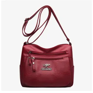 Red PU leather multi-layer crossbody shoulder bag with front zipper pockets detail view