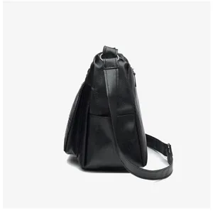 Detail view of black PU leather cross-body bag showing side multi-layer structure.