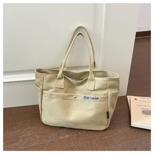 Korean style large capacity beige canvas tote bag with front pocket, casual shoulder bag detail.