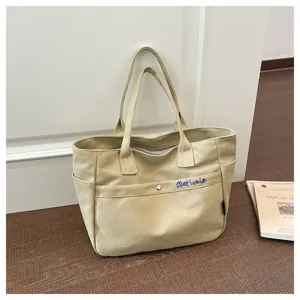 Korean style large capacity canvas tote bag for women, casual solid color versatile shoulder bag.