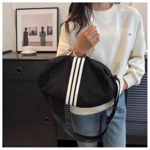 Black large capacity shoulder bag with white stripes, casual travel crossbody bag for women.