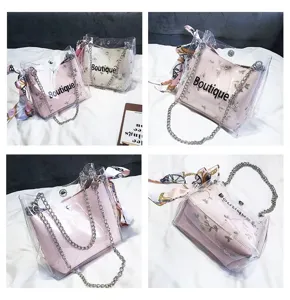 Candy color transparent PVC jelly shoulder bag with chain strap and stylish printed scarf.