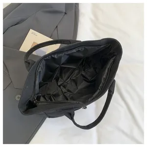 Black canvas tote bag with zipper closure, casual commuter handbag for daily use and students.