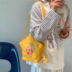 Cute star shaped canvas crossbody bag with cartoon character print and plush pendant.