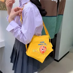 Cute yellow canvas crossbody bag for women girls, star cartoon shoulder bag casual style.