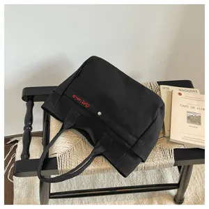Black canvas tote bag, large capacity shoulder bag for women, Korean casual style with zipper.