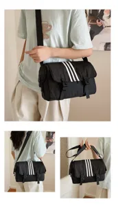 Black nylon crossbody bag for women featuring three white stripes for casual daily commuting.