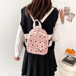 Pink corduroy mini backpack with cute black floral pattern for women daily fashion travel.