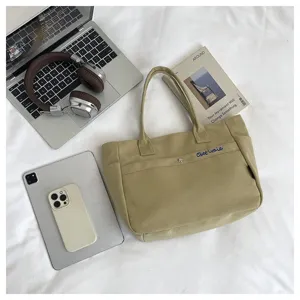 Korean style canvas tote bag, large capacity shoulder bag with zipper and front pocket.