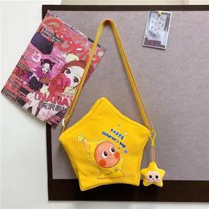 Cute star-shaped canvas crossbody bag for children and daily wear with cute star plush pendant.
