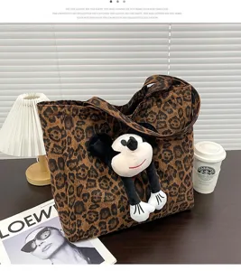 Women fashion leopard canvas tote bag with cute plush cartoon doll large capacity handbag style