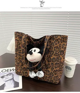 Casual commute leopard print canvas tote bag with plush toy detail for autumn winter daily use.