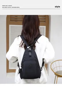 Detail view of lightweight black oxford convertible backpack showing multi-compartment design.