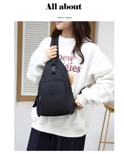 Detail view of lightweight black waterproof oxford chest bag with multi-compartments for daily use.
