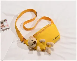 Yellow canvas crossbody chest bag with cute plush teddy bear, casual student shoulder bag.