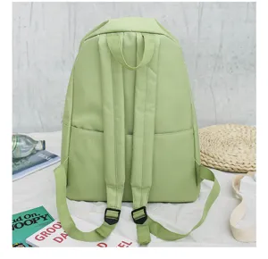 Casual light green canvas backpack for women and students, perfect for school and daily use.