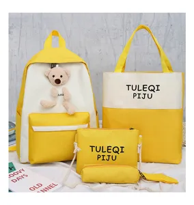 Canvas student backpack set in yellow and white, includes tote bag, crossbody bag, and pencil case.