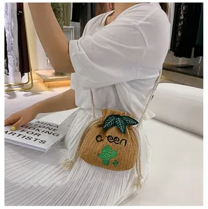 Cute straw bucket bag with cactus embroidery and drawstring closure for casual summer style.