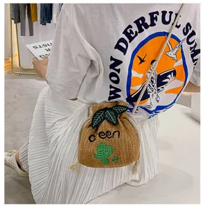 Cute cactus embroidered straw bucket crossbody bag, stylish woven shoulder handbag for women.