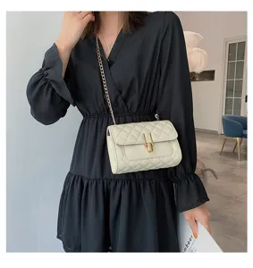 White quilted chain crossbody bag for women with elegant gold-tone hardware and lock.
