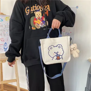 Cute canvas tote bag with blue strap and cute bear graphic for daily student casual use.