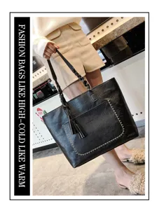 Winter new fashion black PU leather tote bag with braided handle and stylish tassel charm.