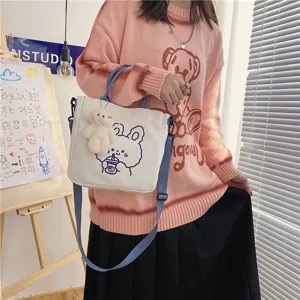 Canvas tote bag detail, cute rabbit print and lovely bear pendant, blue strap, daily casual style.