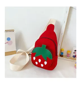 Detailed view of the cute strawberry canvas bag, featuring red body and green leaf design.
