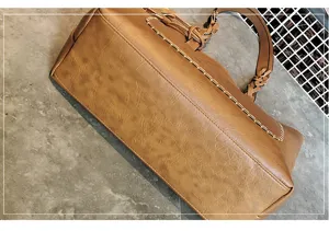 Brown PU leather handbag for women, elegant large capacity tote bag with braided handle.