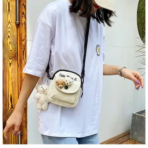 Canvas cross-body bag for women, cute small shoulder bag with adorable bear plush toys for summer.