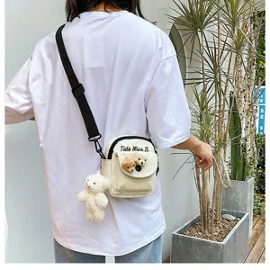 Cute canvas crossbody bag for women with adorable bear plush, perfect summer student phone bag.