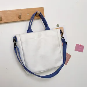 Canvas tote bag for women, casual crossbody shoulder bag with blue straps, stylish daily purse.