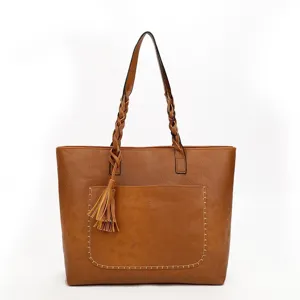 Brown PU leather tote bag for women, featuring stylish braided handles and tassel pendant.