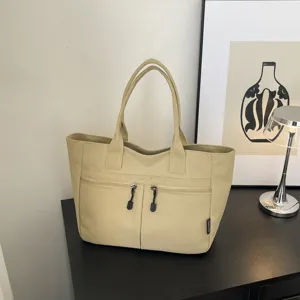 Japanese style canvas tote bag commuter handbag with double zipper pockets and handles.