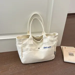 Large capacity canvas tote bag for women, Korean style solid color casual shoulder handbag.