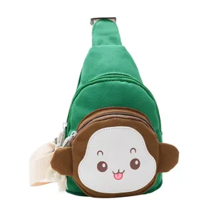 Kids green canvas sling bag with cute cartoon monkey face, casual crossbody chest pack.