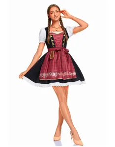 Détail de robe Dirndl traditionnelle allemande, avec broderie florale et bordure en dentelle.