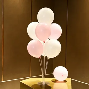 Balloon table stand detail display, featuring white and pink latex balloons setup for parties.