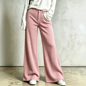 Detail shot of women casual waffle knit wide leg pants in pink, showing soft textured fabric.
