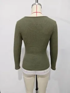 Back view of a minimalist olive green ribbed long-sleeve top featuring a delicate white lace hem.