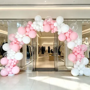 Balloon arch kit scene display showcasing pink and white balloons for party decoration setup.