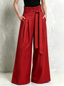 High waist wide leg red trousers with paperbag waist, pleats and fabric belt for women.