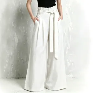 High-waisted linen wide-leg pants for women with paperbag waist, pleats, and belt.