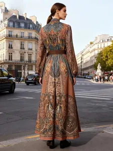 Bohemian floral print long sleeve maxi dress with belt, elegant ethnic style detail view.
