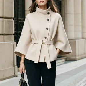 Women stand-up collar asymmetric button wool blend cape jacket with chic belt and flare sleeves.