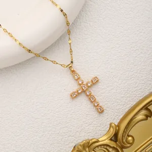 Exquisite gold cross pendant necklace with sparkling rhinestones, fine chain detail shot