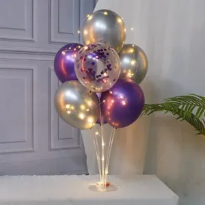 Purple balloon table stand set for birthday party, kids celebration, and romantic event decor.