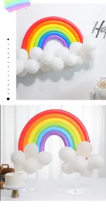 Rainbow balloon arch kit with white cloud balloons for kids birthday party decor.