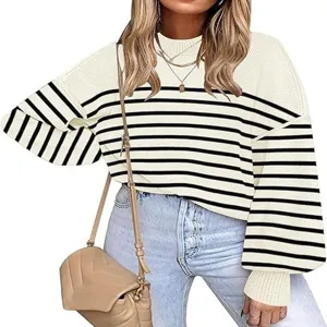 Details of the striped lantern sleeve knit sweater, showcasing cozy round neck and soft texture.